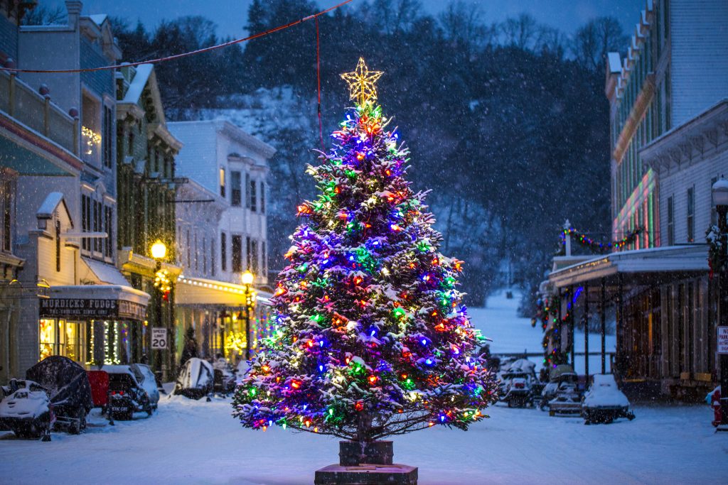 Mackinac Island’s Main Street gets decorated for winter holidays with a Christmas tree right in the middle of the road.