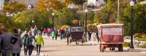 Fall on Mackinac Island brings cooler weather and glorious fall colors as visitors wear sweatshirts and jackets.