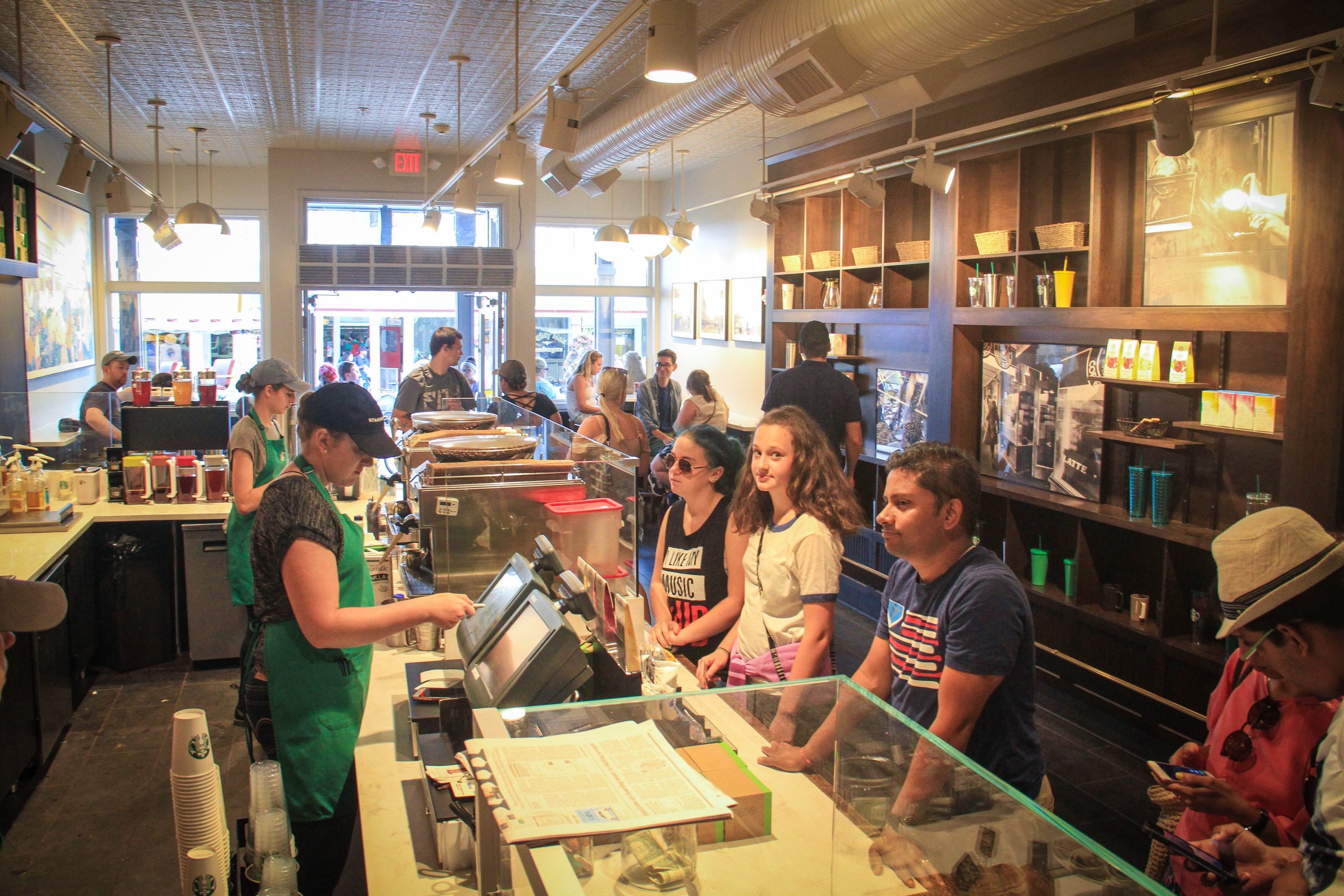 A barista takes orders from guests at the Starbucks on Mackinac Island