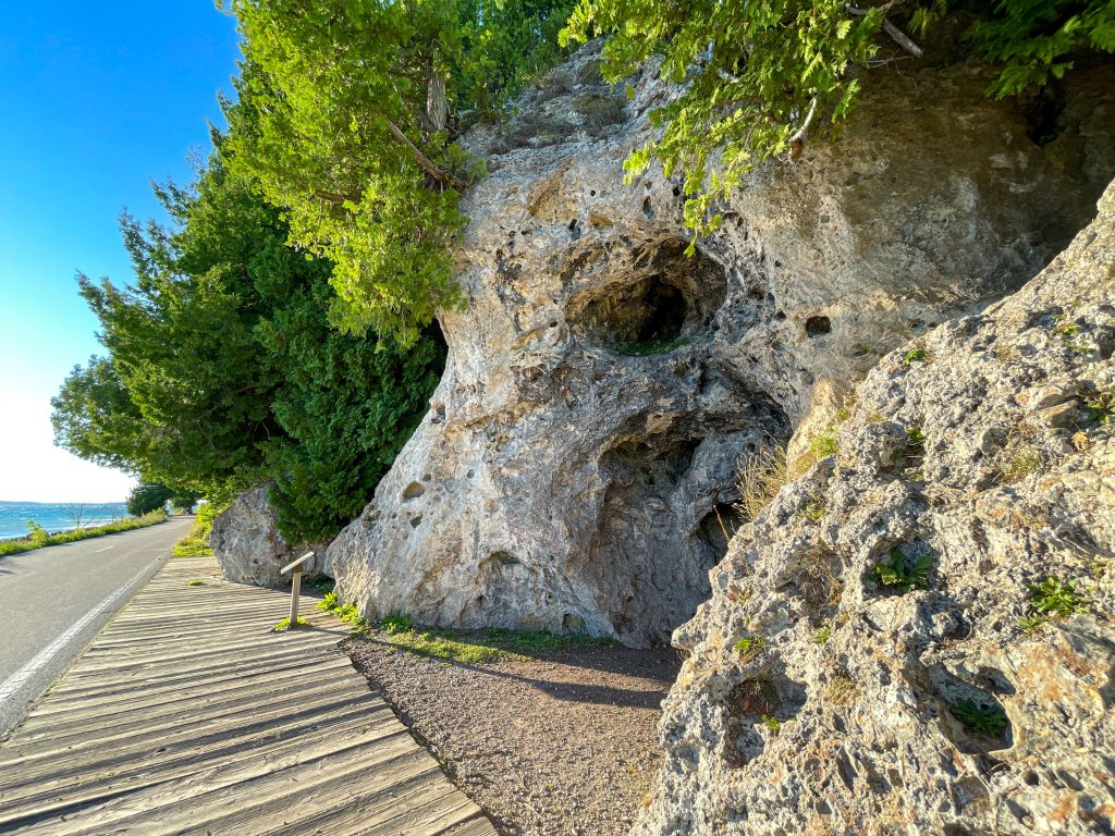 Devil's Kitchen is a rock formation hollowed out by waves on the west side of Mackinac Island along M-185