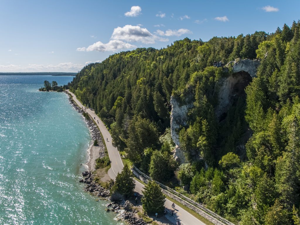 An aerial view of the M-185 highway that circles the outer rim of Mackinac Island and is a popular running route.