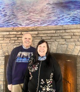 A photo of an Ohio couple who were the first guests of the 2022 season at Mackinac Island’s Mission Point Resort.