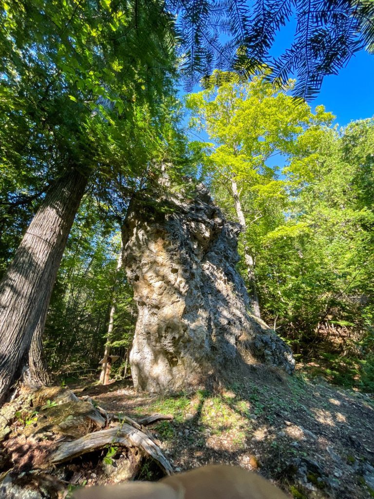 A limestone stack called Friendship's Altar rises out of the earth in Mackinac Island State Park near British Landing