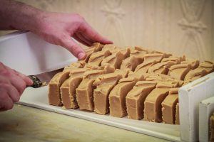 Fudge in the Process of Being Sliced and Served on Mackinac Island