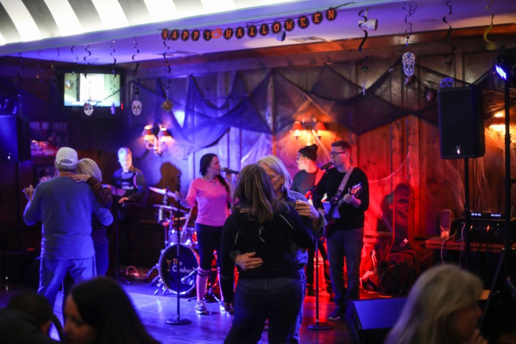 Couples dance to live music at The Gate House bar and restaurant during a Halloween party on Mackinac Island