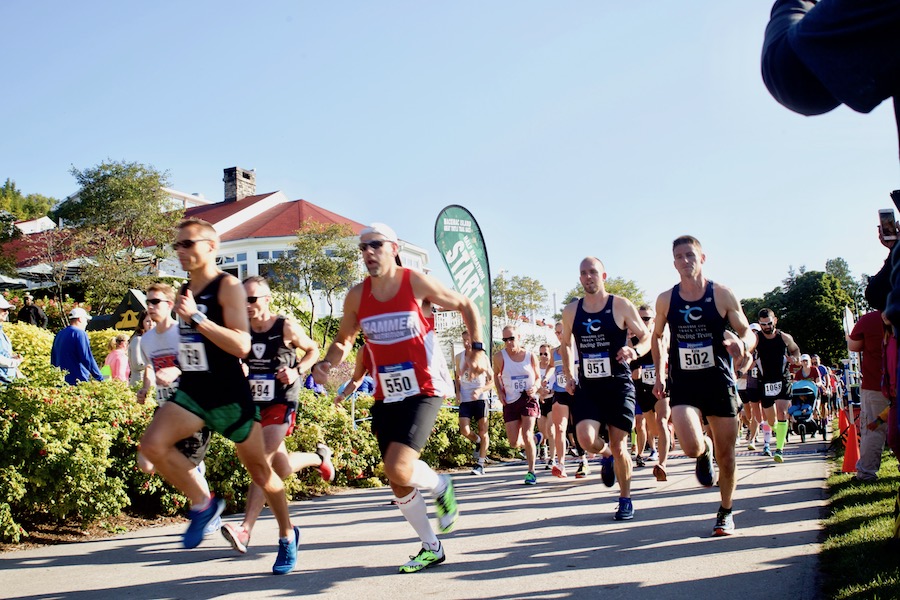 Runners leave the starting line at Mackinac Island's Mission Point Resort during the Great Turtle Trail Run half marathon. 