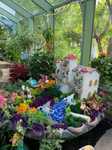 A fairy garden displayed inside of Wings of Mackinac Conservatory on Mackinac Island.