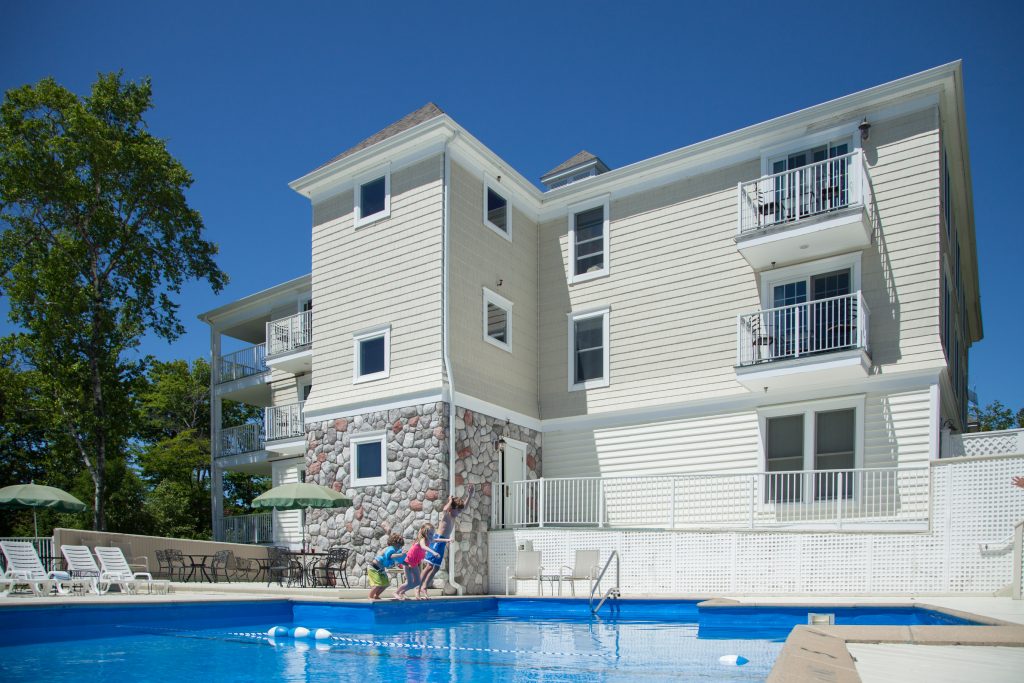 A heated outdoor swimming pool and sun deck is located on the grounds of Mackinac Island’s Inn at Stonecliffe.