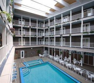 The indoor swimming pool at Mackinac Island’s Lake View Hotel features a hot tub and sauna in the middle of a 4-story atrium.