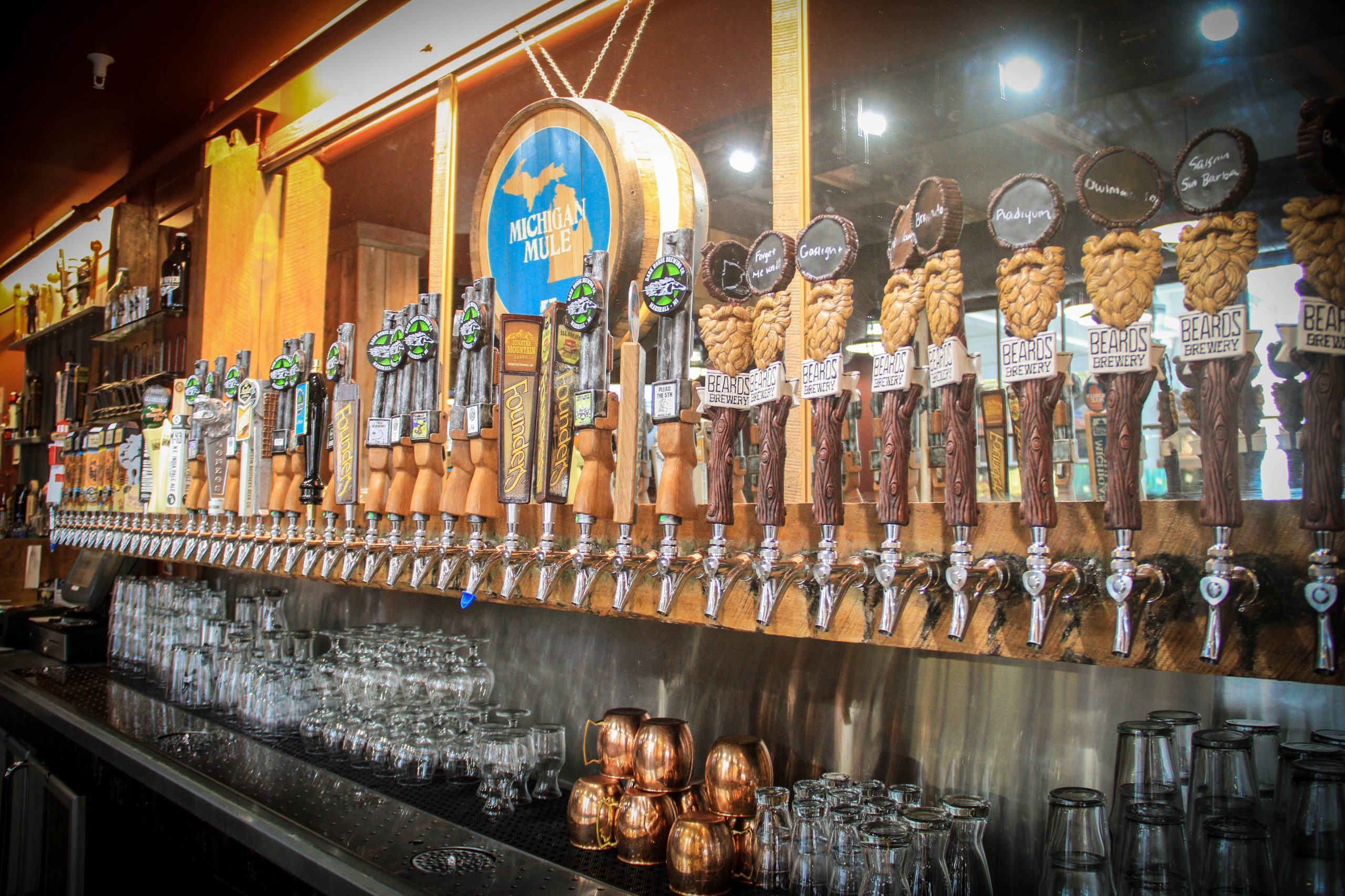 A line of beer tap handles behind the bar at Mary’s Bistro Draught House on Mackinac Island