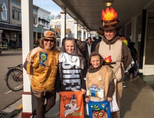 A family dressed in a variety of costumes during Mackinac Island's Halloween Weekend