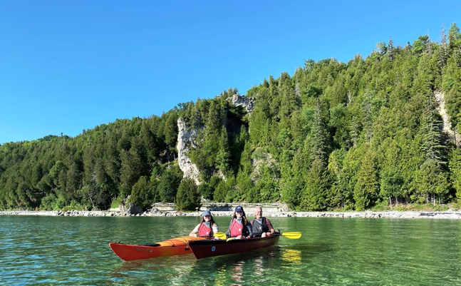 A Mackinac Island kayak tour to Arch Rock presents a unique perspective on the iconic rock formation high above Lake Huron.