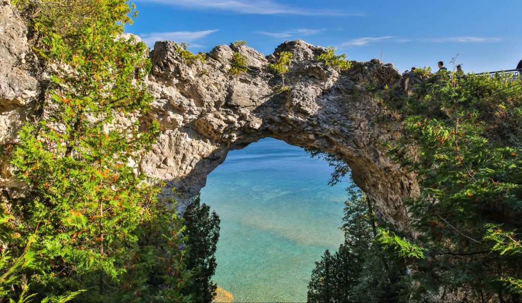 Majestic Arch Rock frames Lake Huron from 150 feet above the shore on a glorious summer day on Mackinac Island