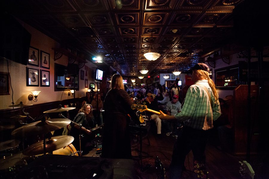 A crowd gathers in a Mackinac Island bar to enjoy live music downtown