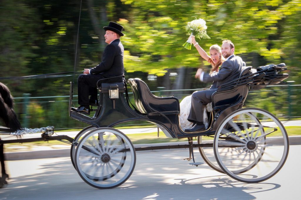 Recently Married Couple Riding in Horse-Drawn Carriage on Mackinac Island