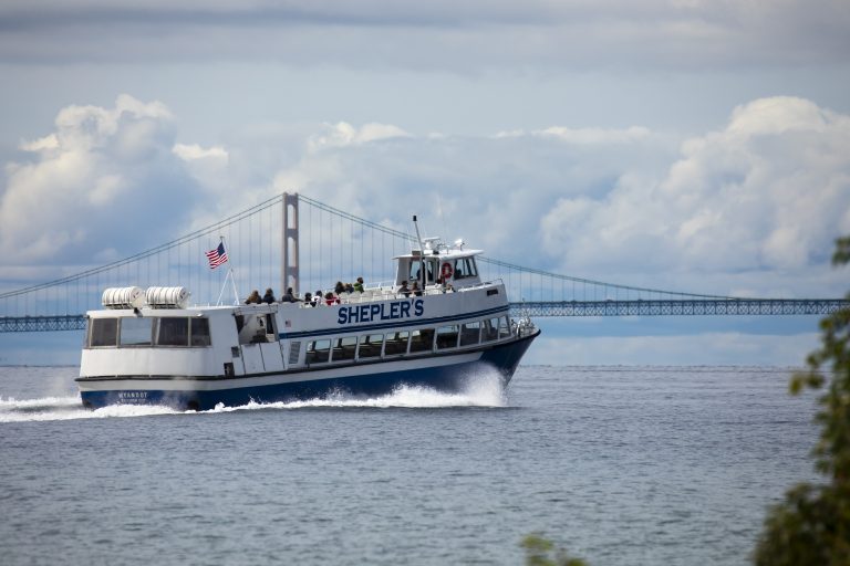 Shepler’s Mackinac Island Ferry rides past the Mackinac Bridge while transporting passengers back to the mainland.