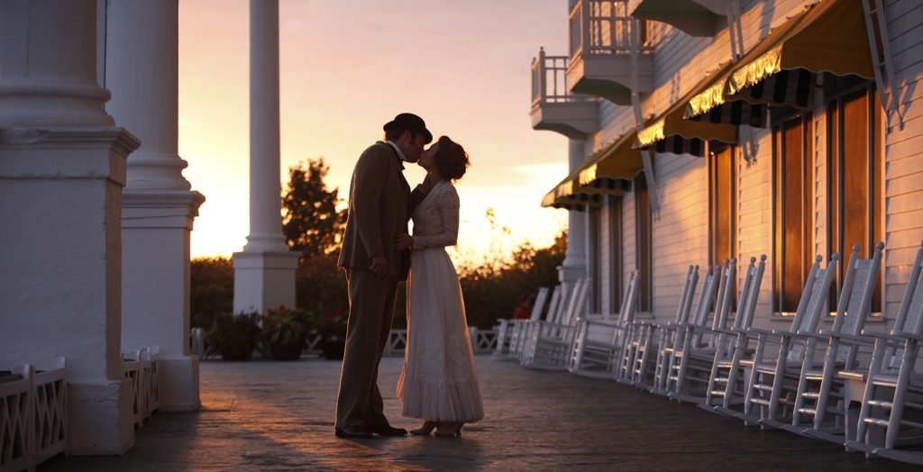 In a scene from 'Somewhere in Time,' filmed on Mackinac Island, Jane Seymour and Christopher Reeve share a kiss on the porch of Grand Hotel