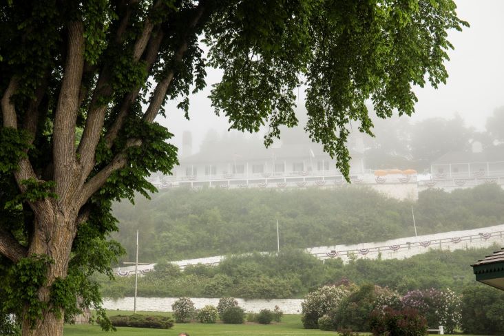 Fog shrouds Mackinac Island's historic Fort Mackinac as seen from below in Marquette Park
