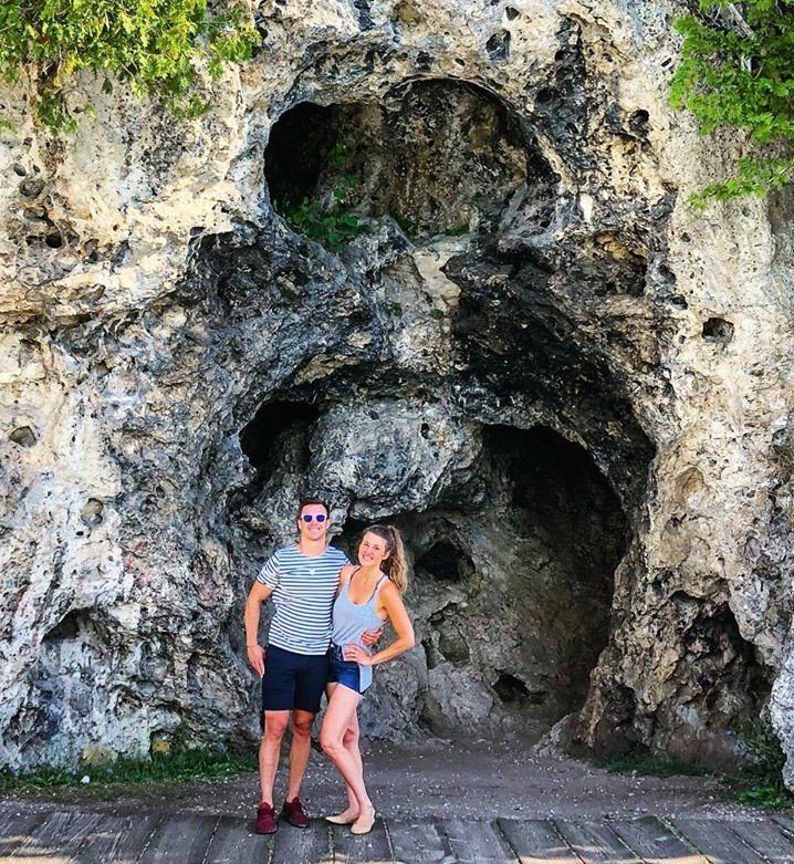Couple Posing for Photo Outside Devil’s Kitchen on Mackinac Island