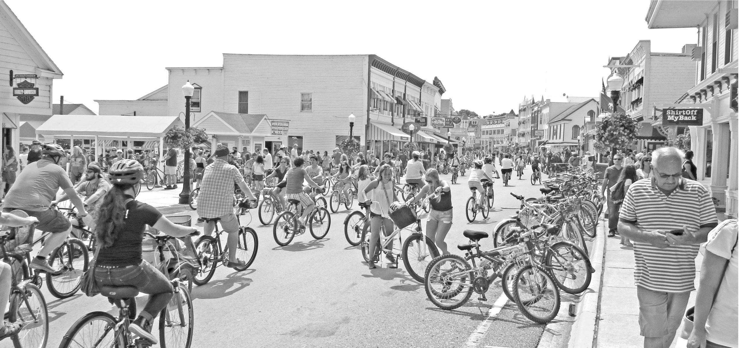 Black and white image of bicycle traffic on Mackinac Island's Main Street