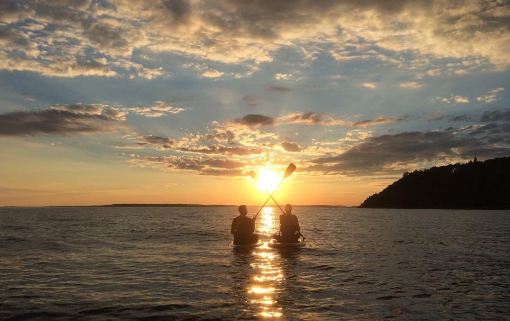 Couple Watching Sunset in Kayaks – Mackinac Island Tourism Bureau