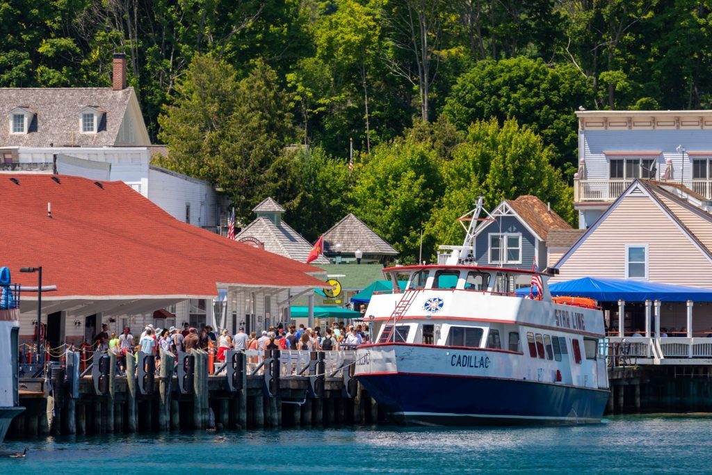 A Mackinac Island ferry boat welcomes passengers aboard at the dock