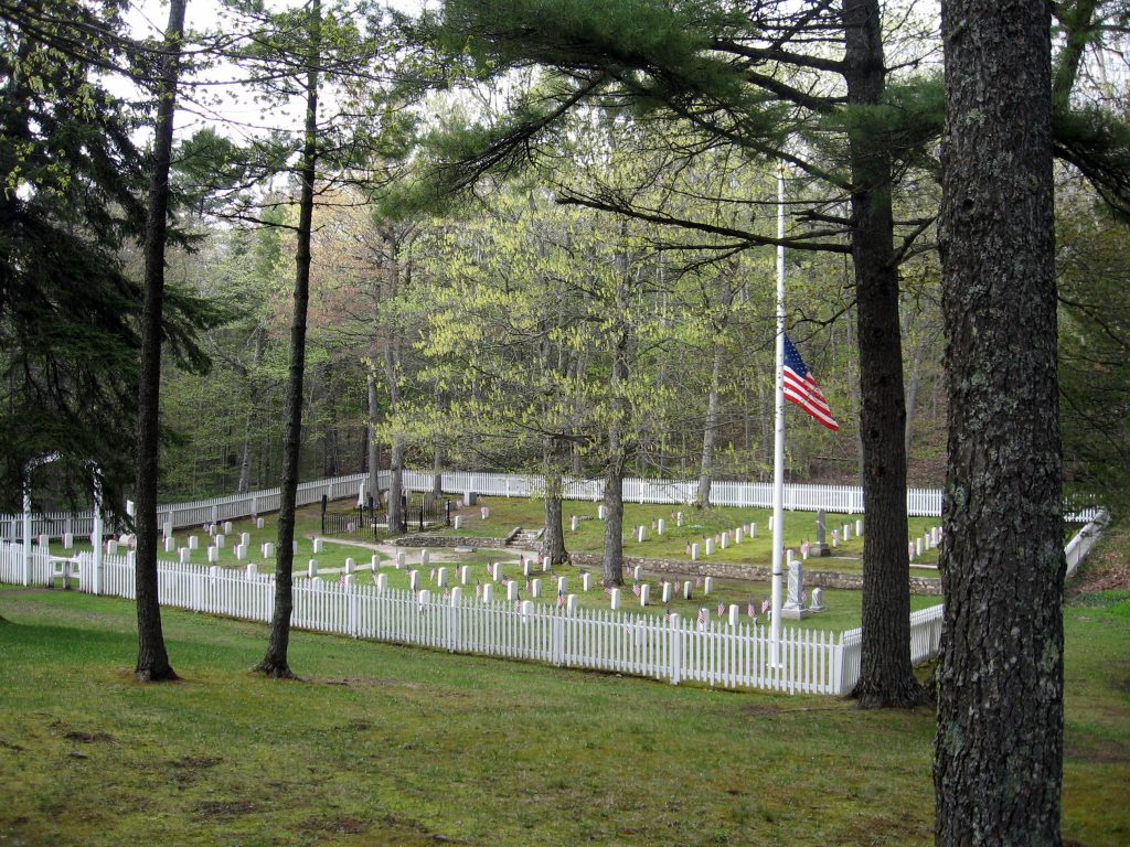 The U.S. flag flies at half mast in Mackinac Island's Post Cemetery