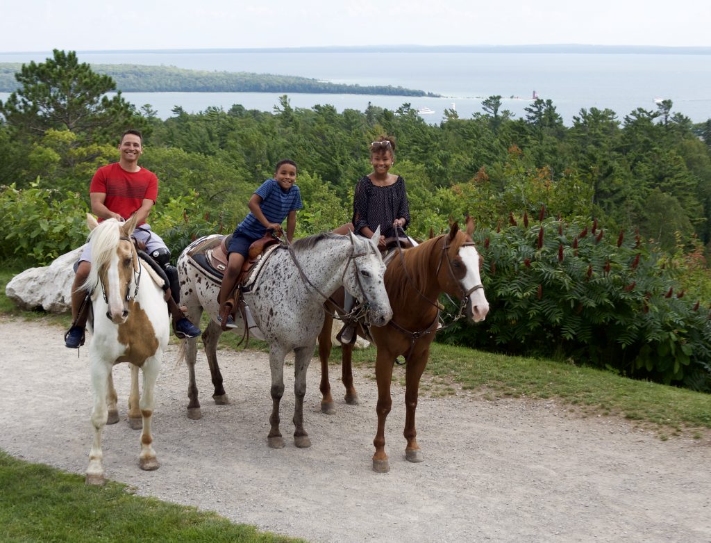 Mackinac Island’s outer rim is mostly flat, while the interior has elevated, rugged terrain perfect for horseback riding.