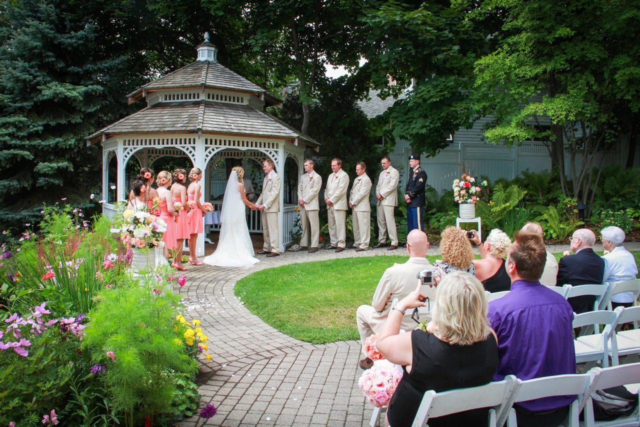 A bride and groom exchange vows during a wedding ceremony on Mackinac Island