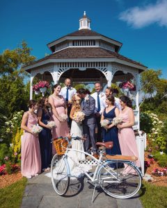 Wedding Party Posed for Photo Around Newly-Weds in Gazebo on Mackinac Island