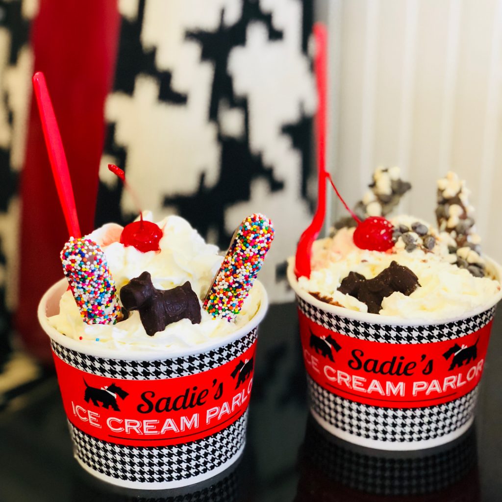 Two Ice Cream Sundaes in Red Cups from Sadie’s Ice Cream Parlor