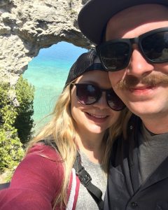 Couple Posing by Arch Rock for Selfie on Mackinac Island