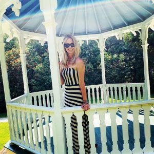 A young woman stands in the 'Somewhere in Time' gazebo on Mackinac Island
