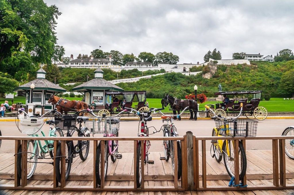 Six Bikes Parked at Rack Along Road on Mackinac Island
