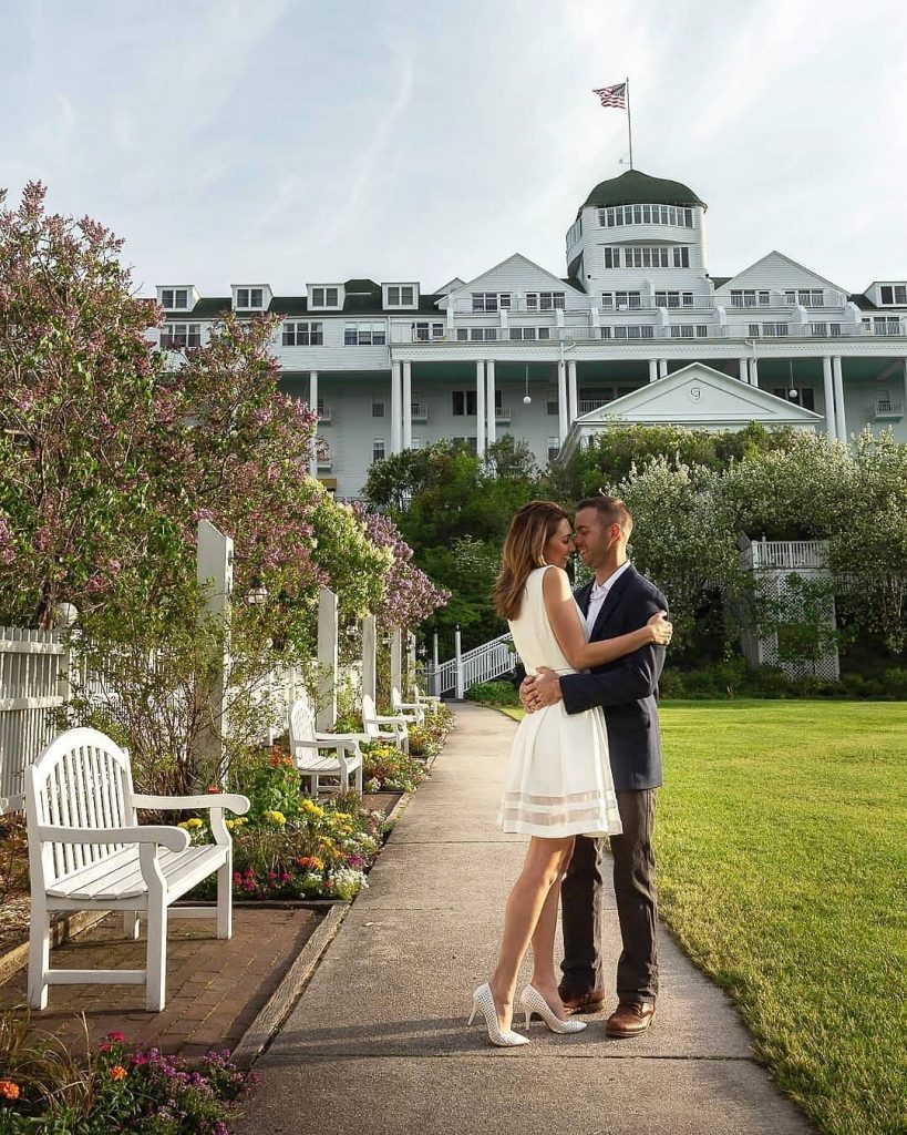 Couple Embracing for Photo in Front of Grand Hotel on Mackinac Island
