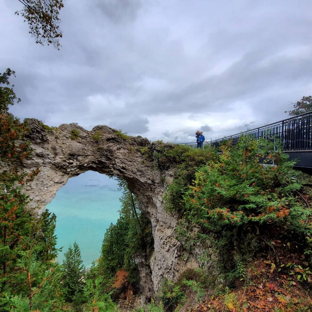 Arch Rock is one of the most picturesque landmarks in Mackinac Island State Park and a popular selfie spot for visitors.