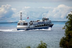 A Shepler’s Ferry boat approaches the Mackinac Bridge while bringing passengers to Mackinac Island