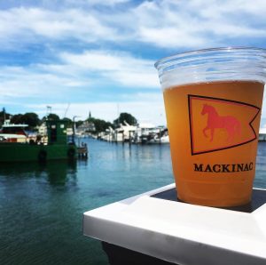Cold Beer from Mary’s Bistro Draught House Against View of Docks off Mackinac Island
