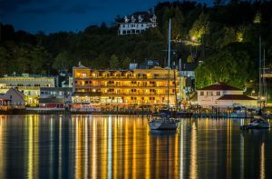 Lights from The Chippewa Hotel on Mackinac Island reflect on the water in the harbor at night